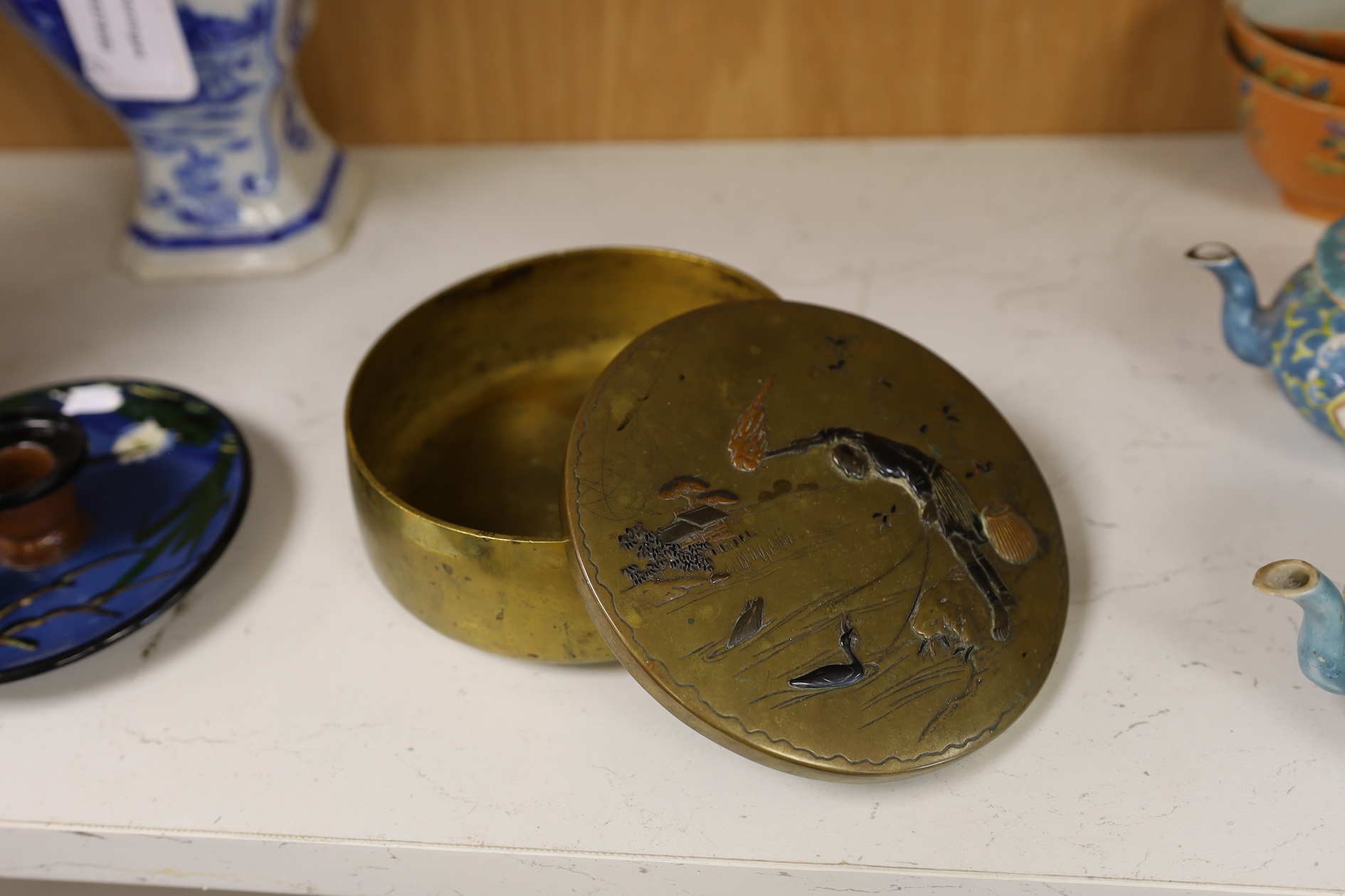 A Japanese bronze and mixed metal mounted box and cover, Meiji period, 13.5cm diameter. Together with a pair of plated jugs Condition - fair to good